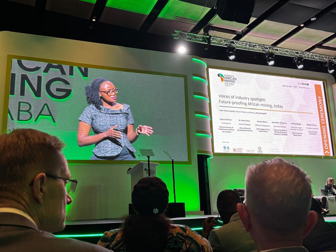 African woman speaking at a mining indaba forum